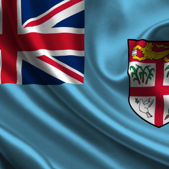 fiji-flag-union-jack-in-the-corner-light-blue-around-union-jack-shild-with-red-cross
